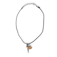 Sterling silver feather, with natural stone and gem, on black cording. Choker is on solid white background.